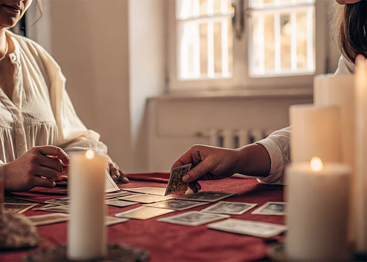 Tarot Cards White Candles Red Tablecloth Interp